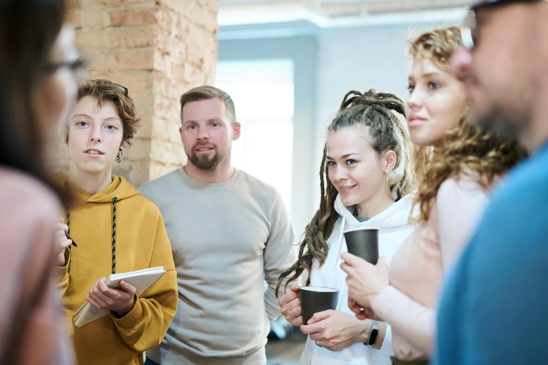 Spare keys pexels-fauxels-3182772 Image showing mix of informally-dressed adults being briefed at a stand-up meeting in room with brick walls. These are the key personnel in a business.