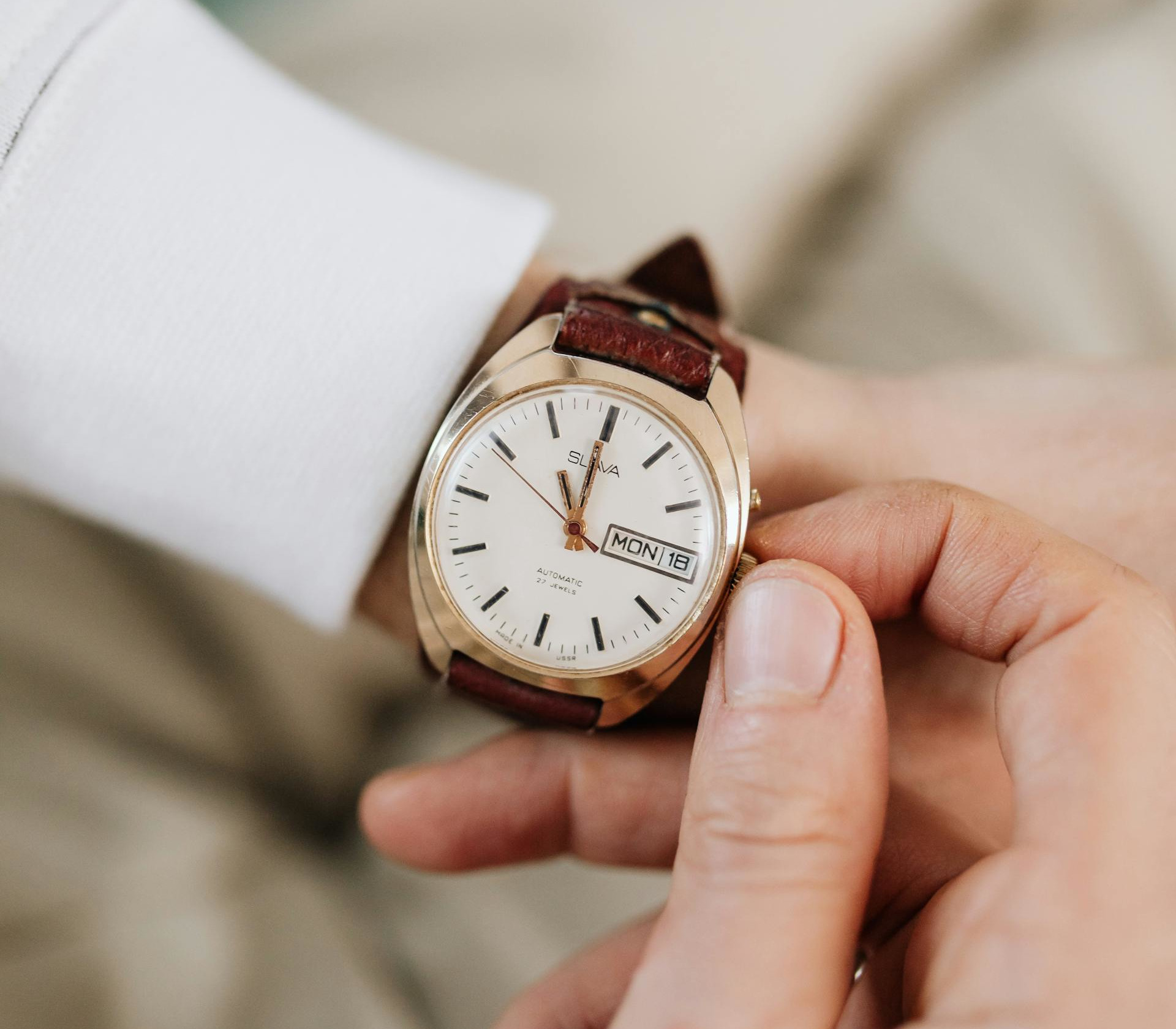 Winding back time Image shows man's wrist with watch. Man is making an adjustment to the displayed time. Time cannot be recovered so using it wisely to prepare a strategy is a good idea.